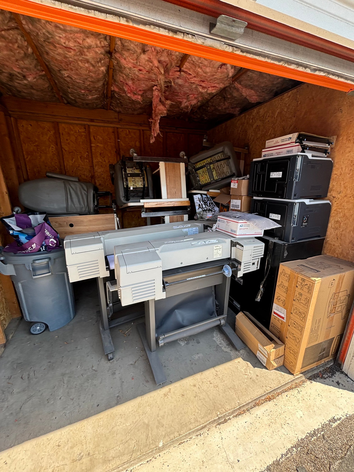 Storage unit filled with office equipment