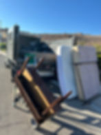 Junk Next to a Junk Truck