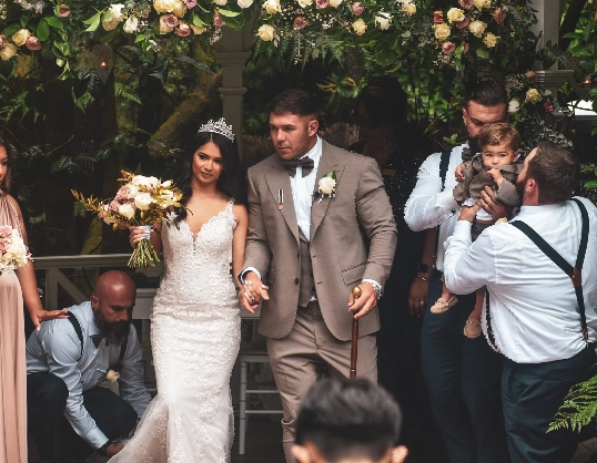 bride and groom walking from altar.png
