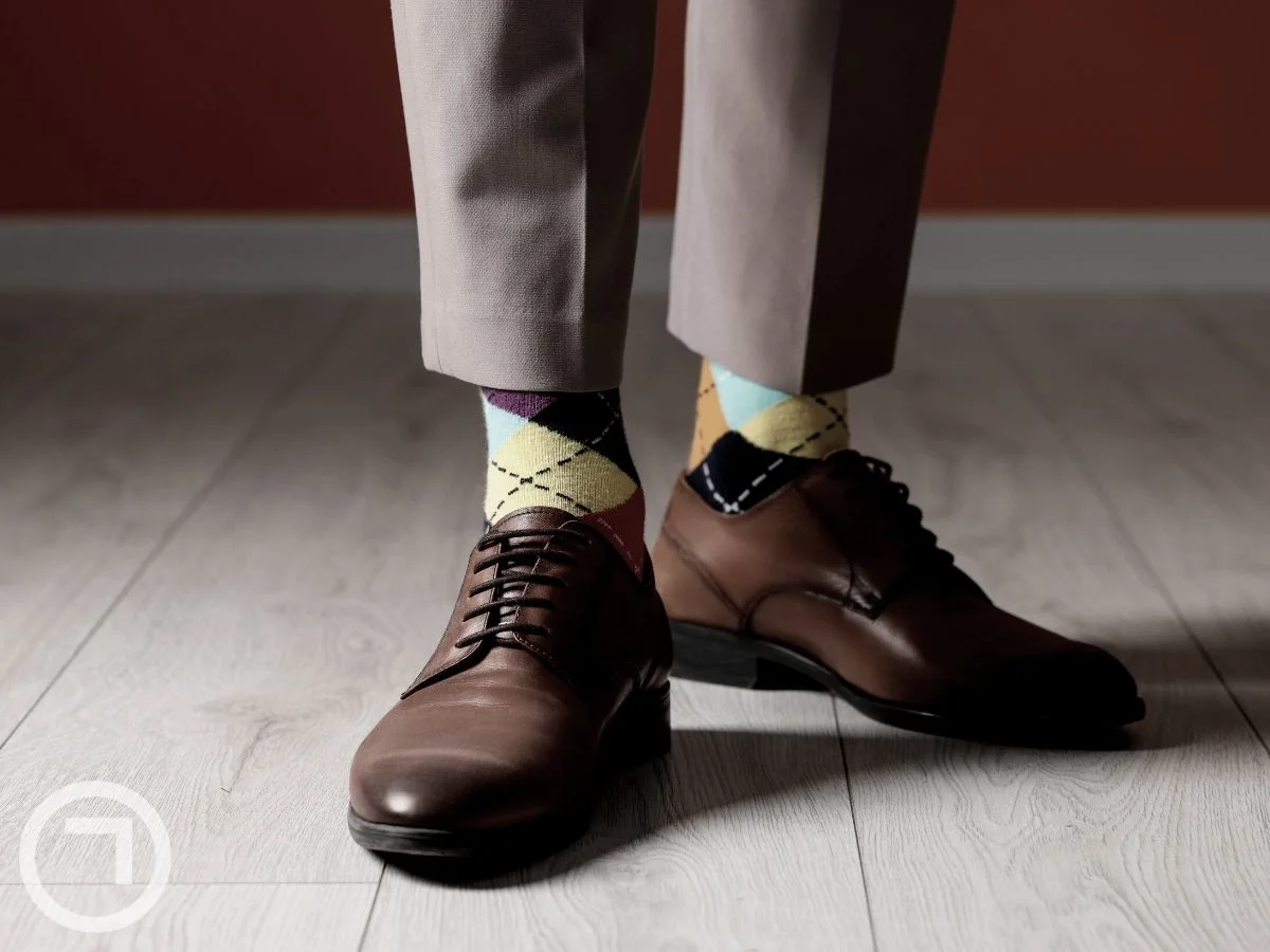 A pair of socks and shoes on a man's feet
