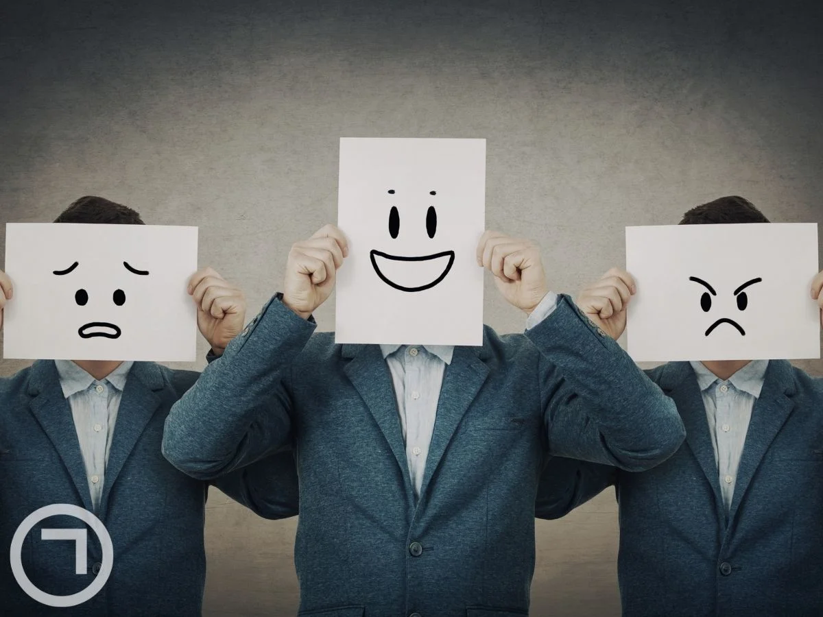 Men holding different emotion placards