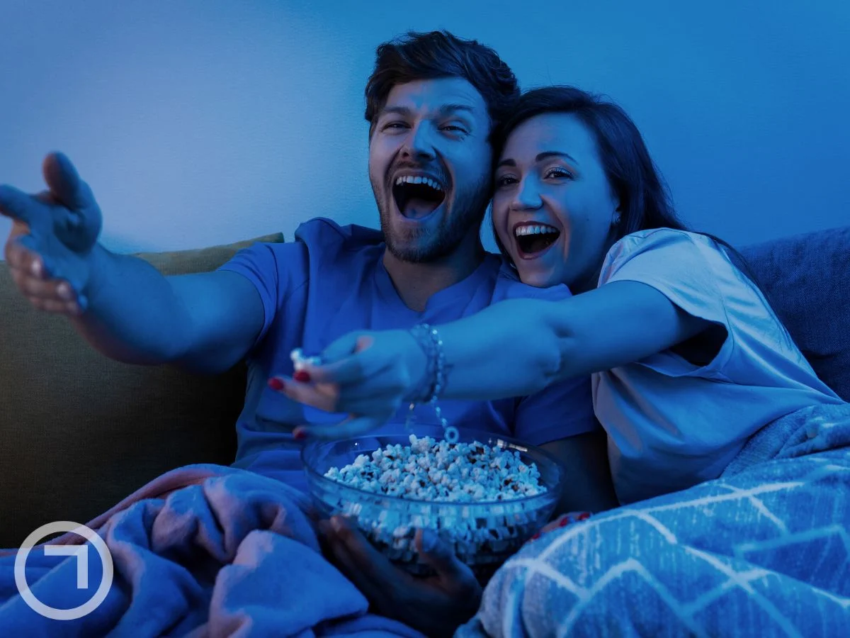 A couple watching something together