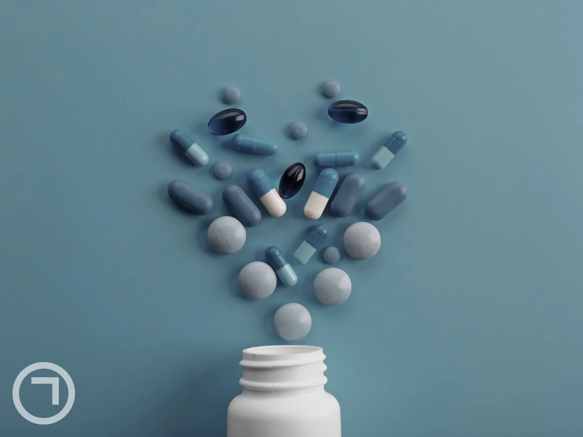 Tablets and capsules spilling out of container