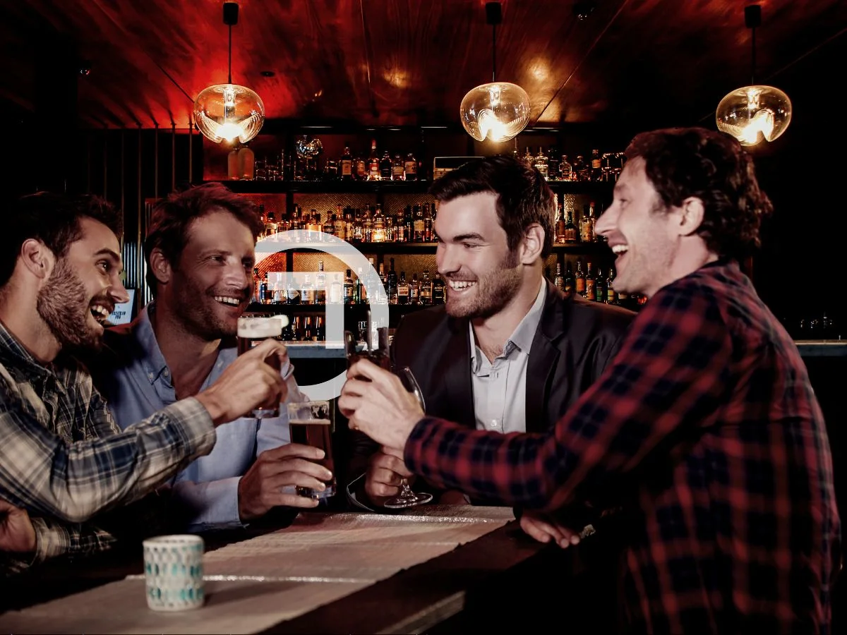 Four friends having fun in a bar