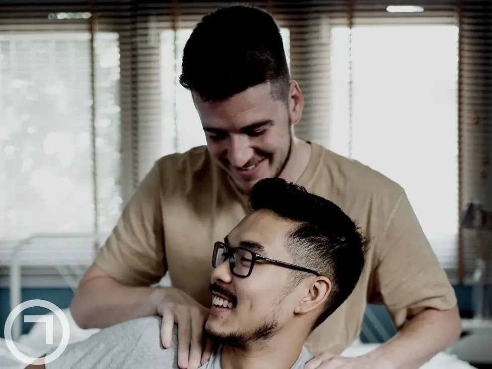 A buy giving shoulder massage to his friend