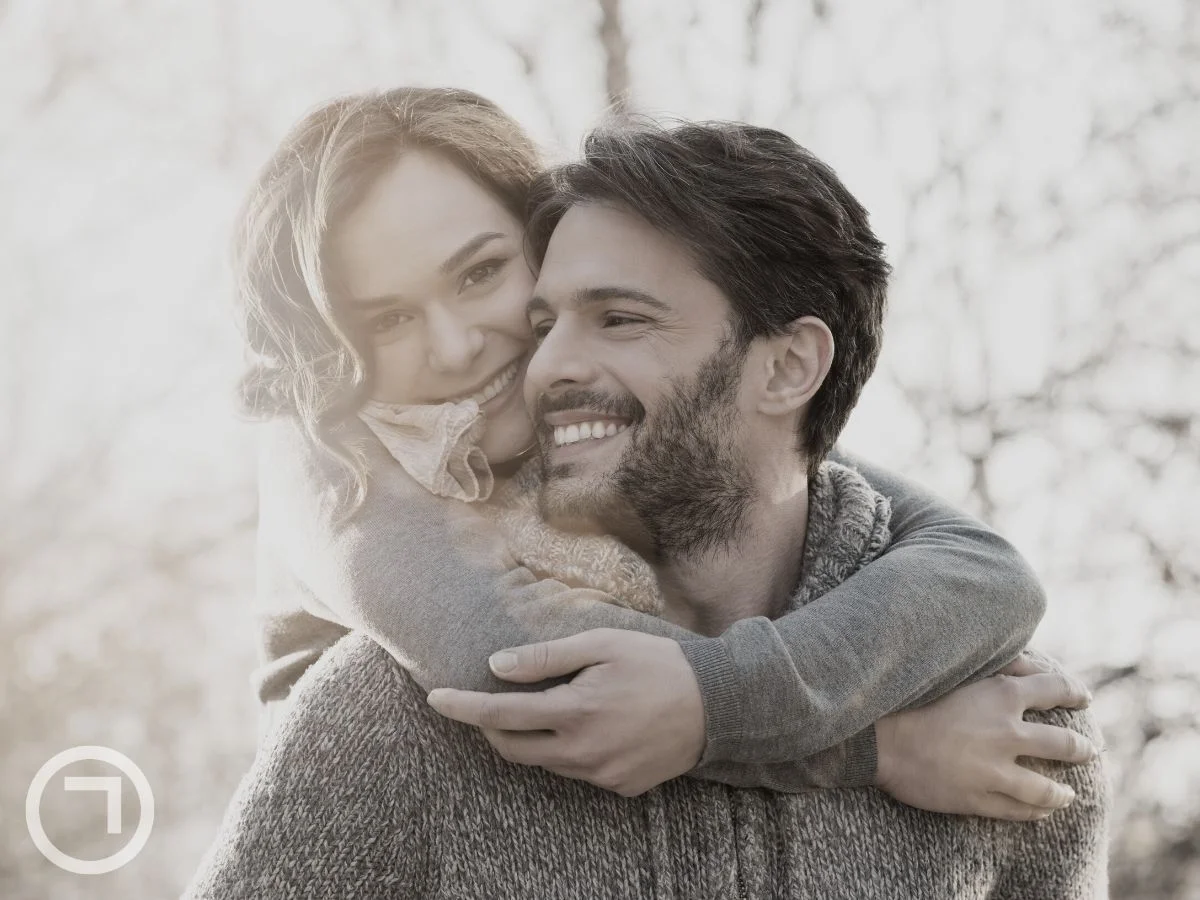 A girl hugging her partner from behind