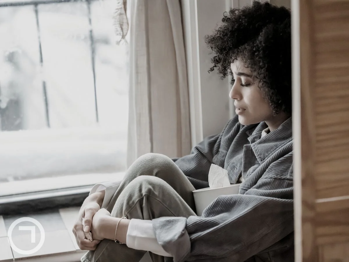 A woman sitting alone