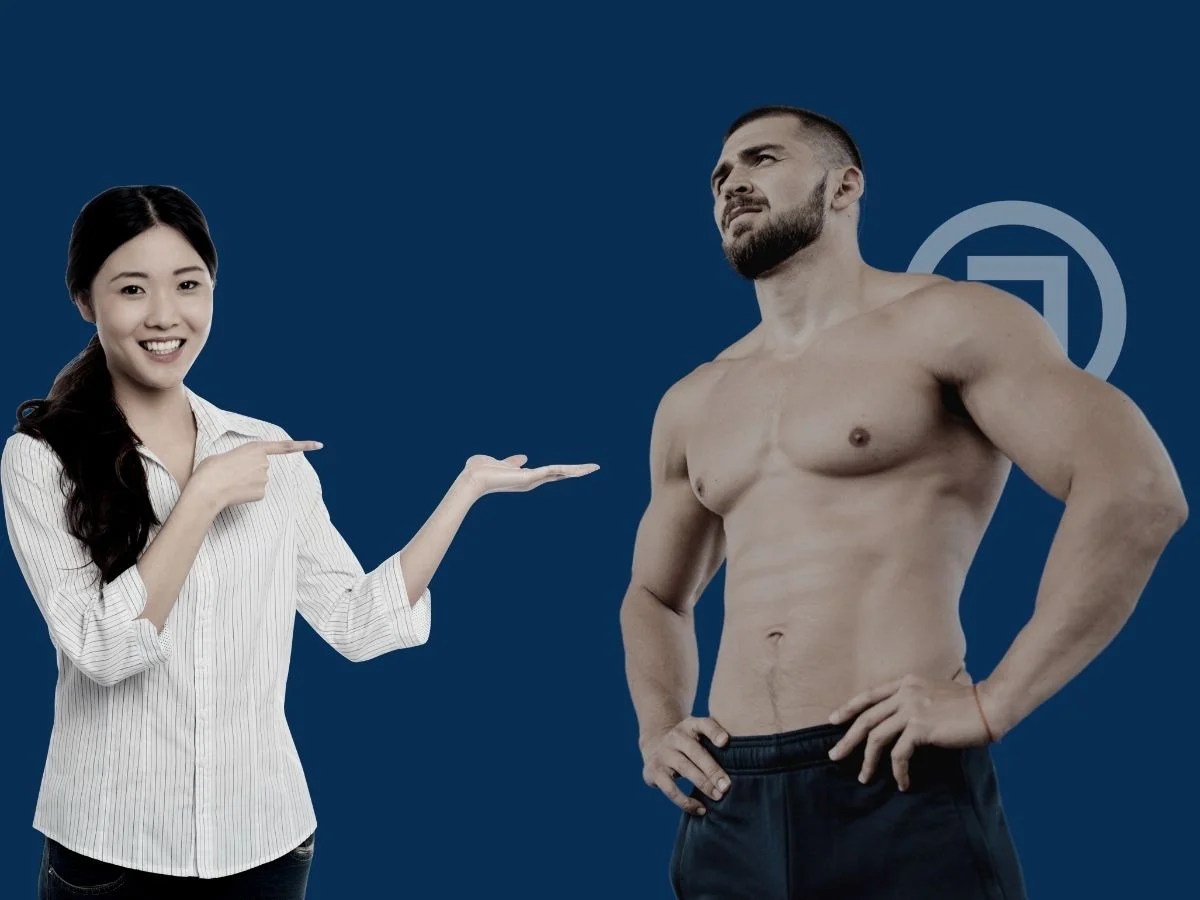 A woman pointing toward a muscular man