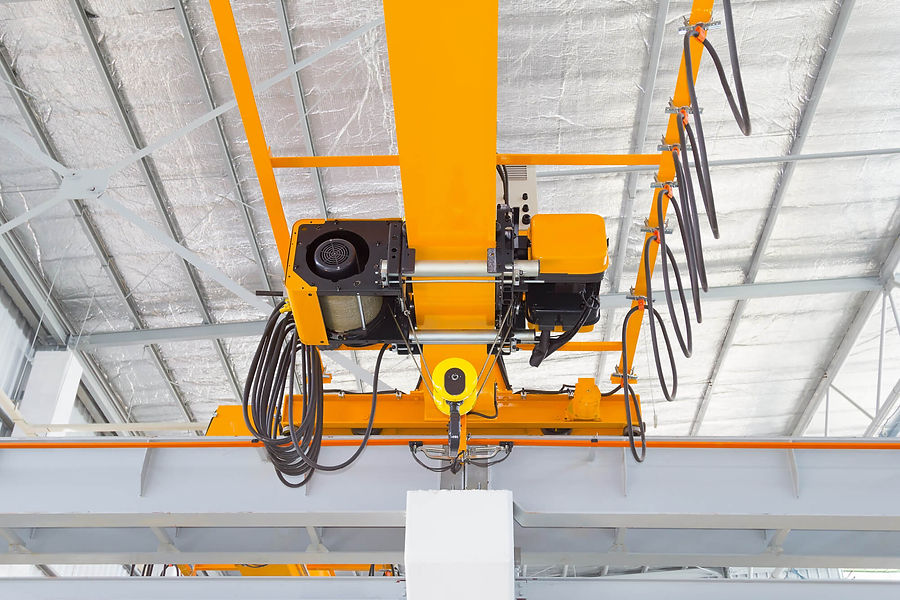 Overhead crane and hook inside factory building for lifting work