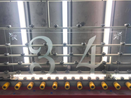 Sandblasted glass panel etched with '34'