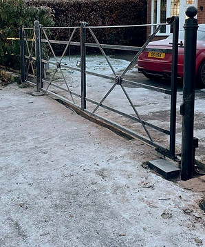 Decorative wrought iron gates securing a local driveway