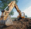 excavator digging a trench on the site
