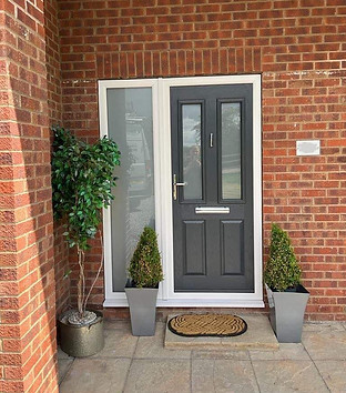 Composite door with glass side panel