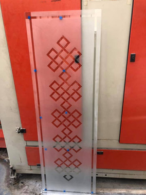 Sandblasted mirror with intricate geometric pattern