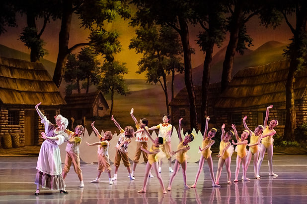 Kids professional ballet school students performing in theater