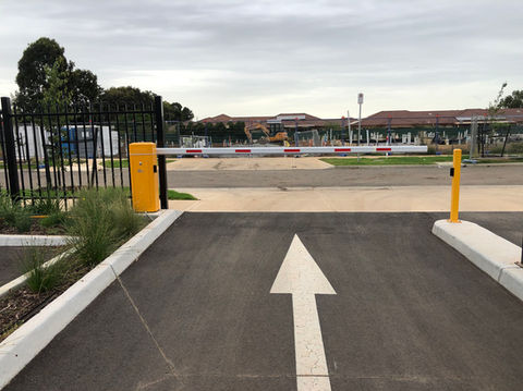 Driveway boom gate with induction exit loop detector