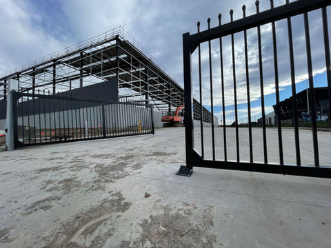GDS7 swing gate opener on industrial raising hinged gates
