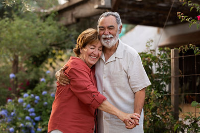 elderly-couple-holding-each-other-romantically-their-countryside-home-garden.jpg