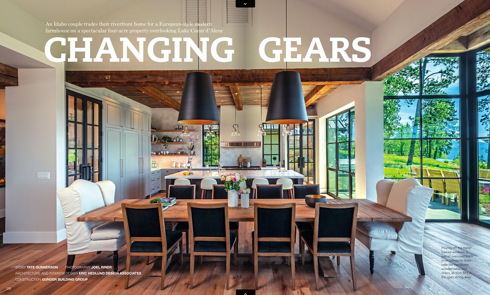 Rustic dining room with wooden table, black chairs, and large windows overlooking greenery. "CHANGING GEARS" text on image. Cozy, vibrant.