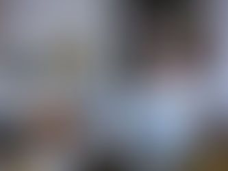 Caucasian woman imitating punches with humanoid cyborg while practicing boxing in living room