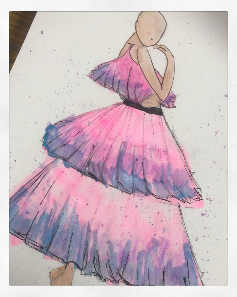 Fashion sketch of a faceless woman in a layered pink and purple dress on white paper with paint splatters