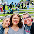 Tanja and Erin with a Recess participant smiling and looking at the camera