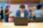 Man working at office using his computer.jpg