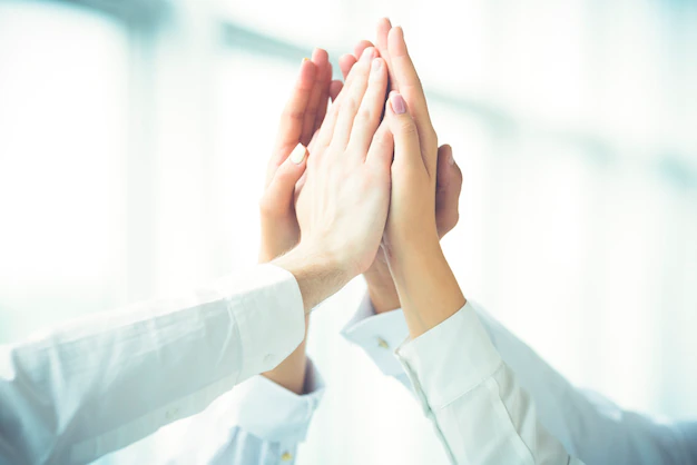 four-hands-greeting-with-high-five_474601-1928.jpg.webp