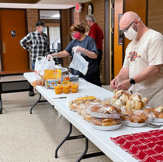 Deanna and Pastor Matt readying the food