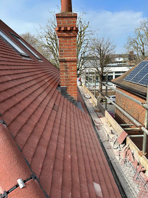 Red tiled roof with chimney