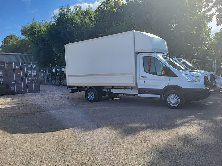 White delivery truck parked nearby