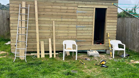 Wooden shed under construction outdoors