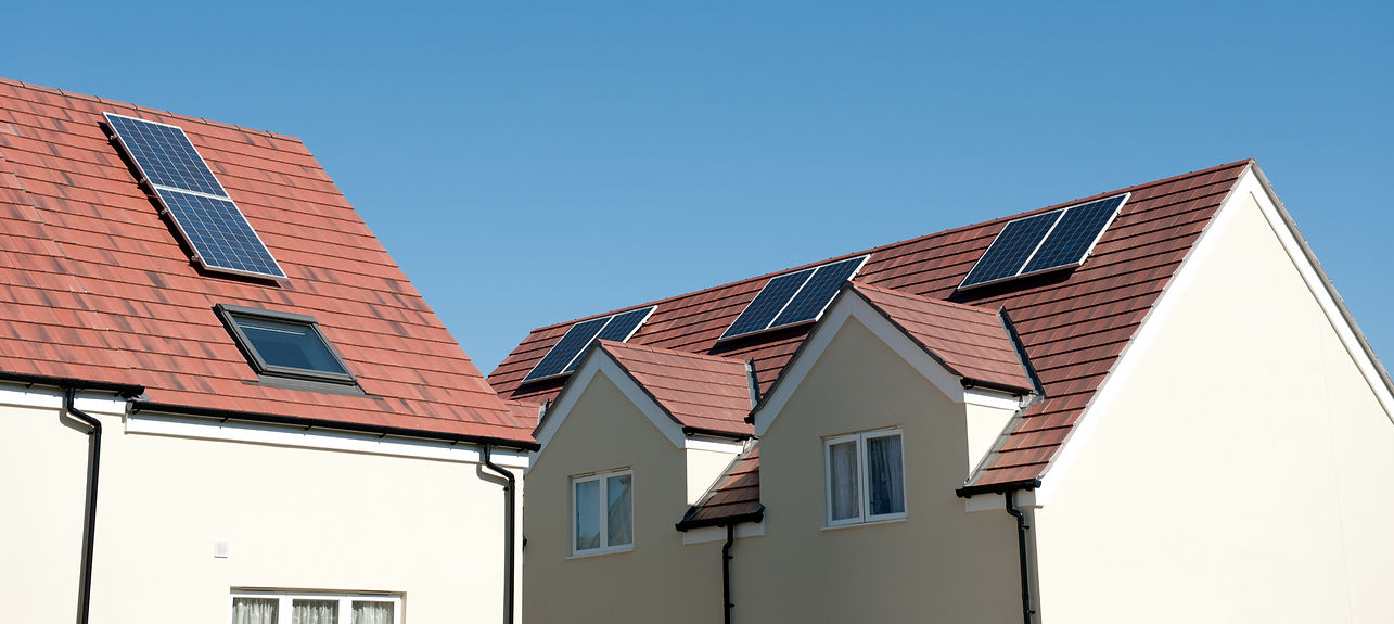 Solar panels installed on the roof of a house, showcasing renewable energy technology in a residential setting