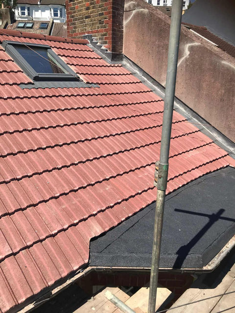 Roof with skylight and scaffolding