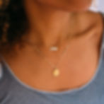 Layered gold necklaces with nameplate