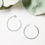 Thumbnail: Silver hoop earrings on white background