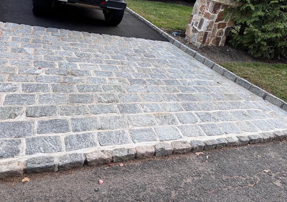 Eye-level view of worker repointing mortar on brick wall