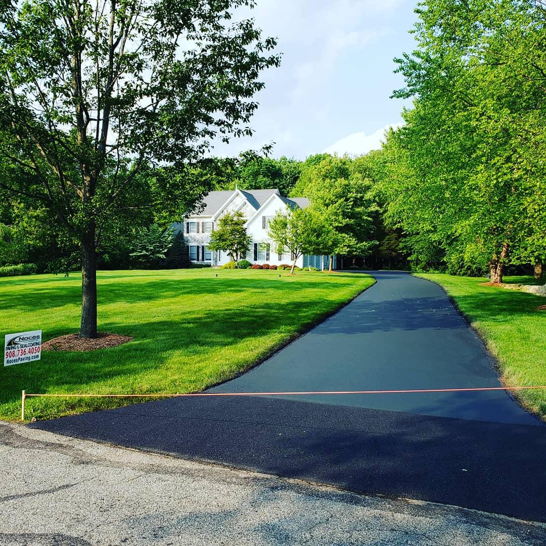 All American Asphalt crew and equipment on a paving job site