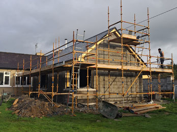 Scaffolding around a building under construction.