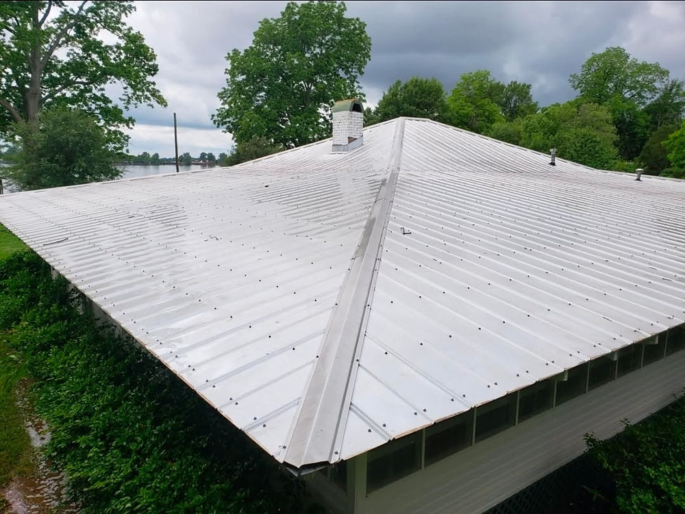 Wide, multi-sloped metal roof on a house
