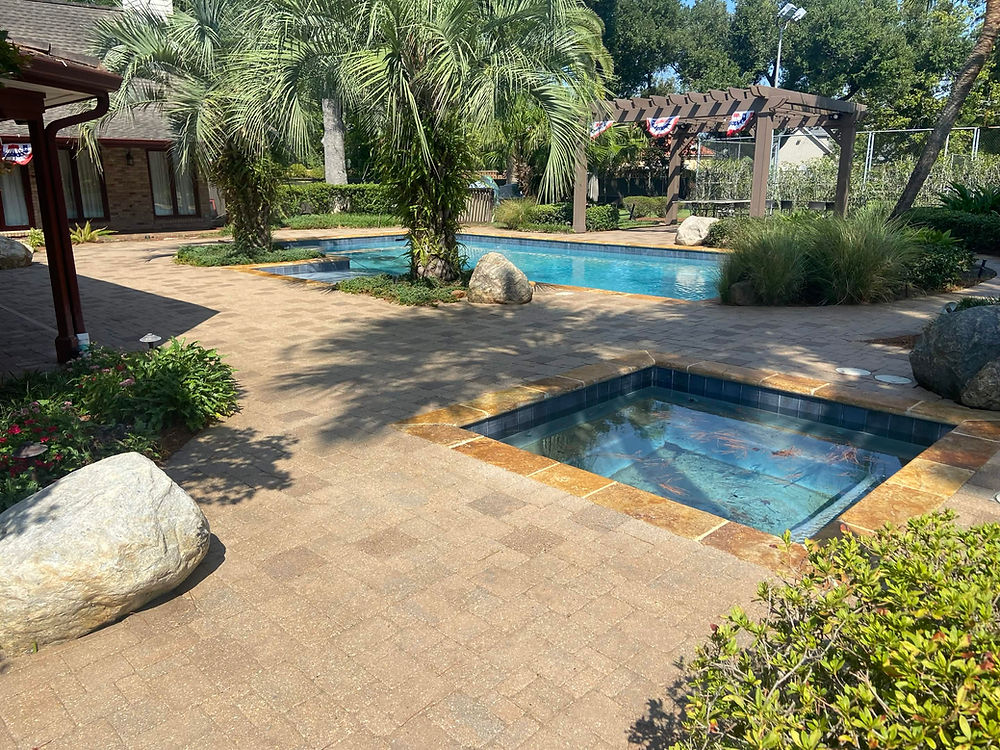 Clean outdoor area with pools and pavers, exterior cleaning results