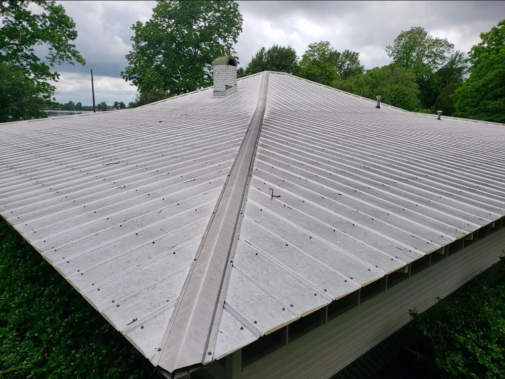Clean ribbed metal roof with a chimney