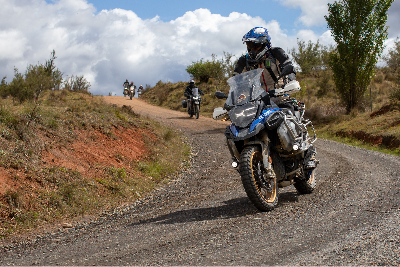 An adventure motorcycle riding on a dirt road