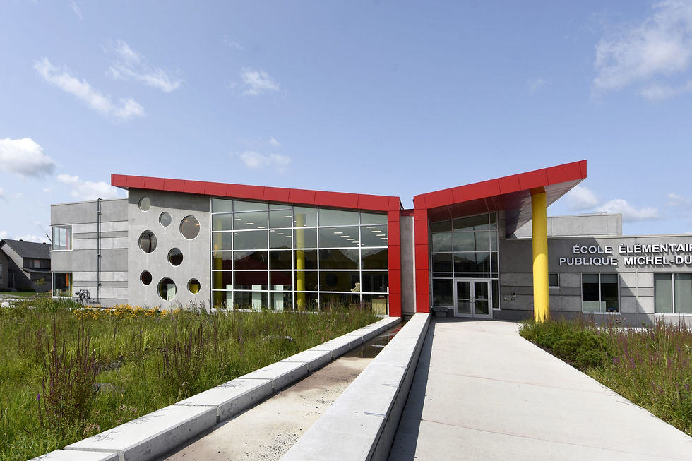 Interior painting project at Riverside South Elementary School, featuring vibrant red and yellow architectural walls, clean finishes, and bright educational spaces completed by Vision Painting.