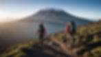 vecteezy_two-people-with-backpacks-walking-up-a-mountain_46252713