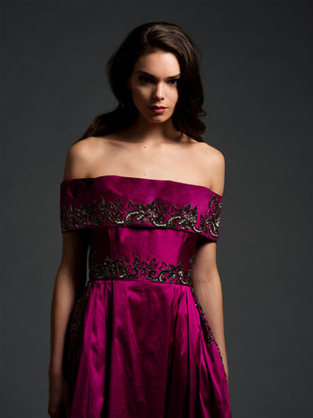 portrait of woman in off the shoulder beaded fuschia taffeta ballgown