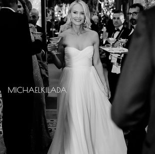 woman in bridal gown holding champagne glass