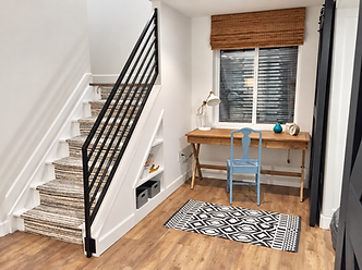 Making every corner count with under-stair storage and a tucked-away workspace