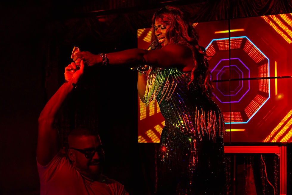 Coco Caliente entertains an attendee of "Coco's Cabaret."