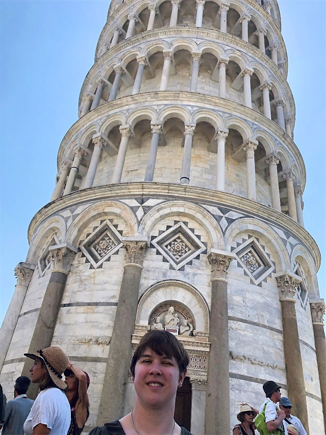 A selfie of Shannan in front of the Leaning Tower of Pisa.